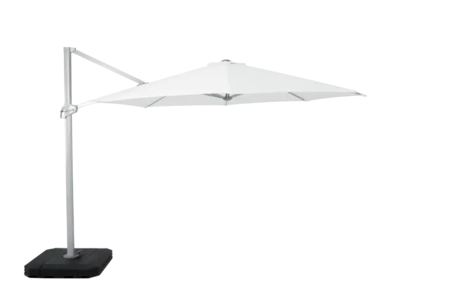 Side profile of the fully opened Chavela cantilever umbrella. The image showcases its expansive white canopy extended from the sturdy silver side-post and secure base.
