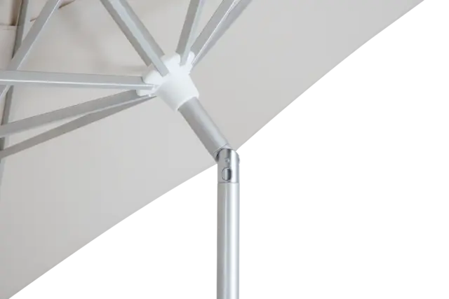 A close-up view underneath the canopy of the Easy Life I center pole umbrella, highlighting the strong aluminum frame, support ribs, and the push-button tilt joint.