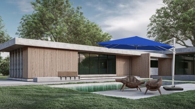 A large blue Mass cantilever umbrella providing ample shade over two wicker lounge chairs next to a modern swimming pool and a contemporary house.