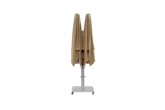 A full product shot of the M2 Maximus double-headed parasol in its completely folded and closed position, standing upright on its wheeled base.