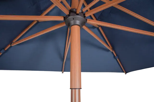 Detail of black hardware connecting the wood-tone ribs on the Piazza center pole square market umbrella's internal frame.